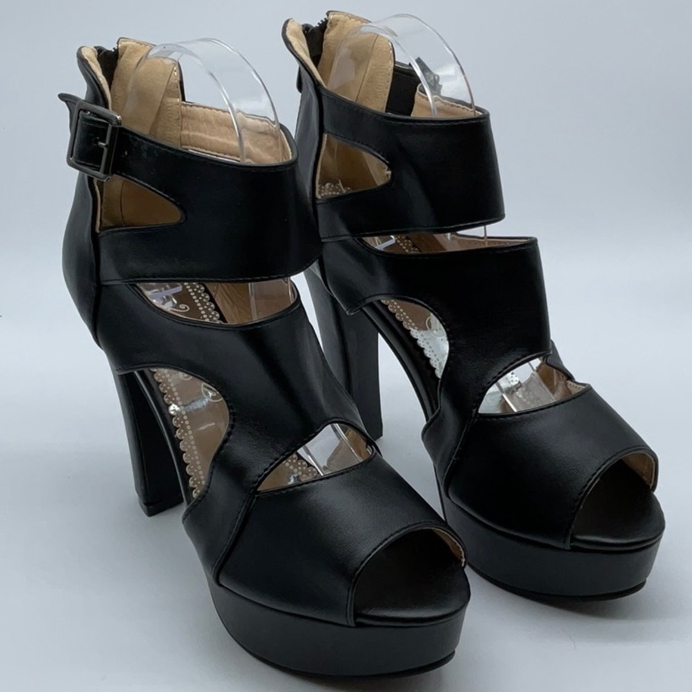 Black cross strap platform heels with zipper closure